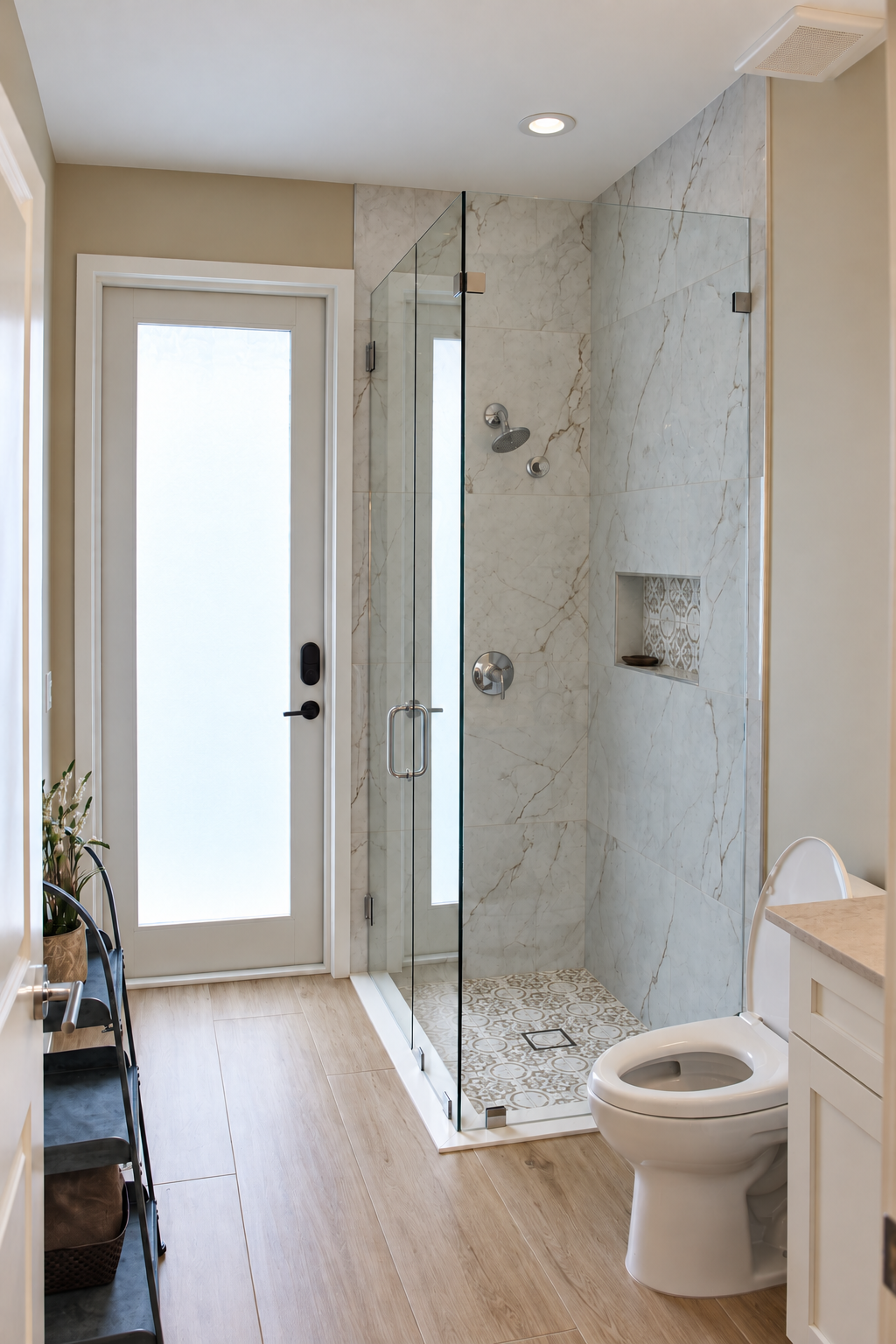 Bathroom after installation of a custom frameless glass shower enclosure